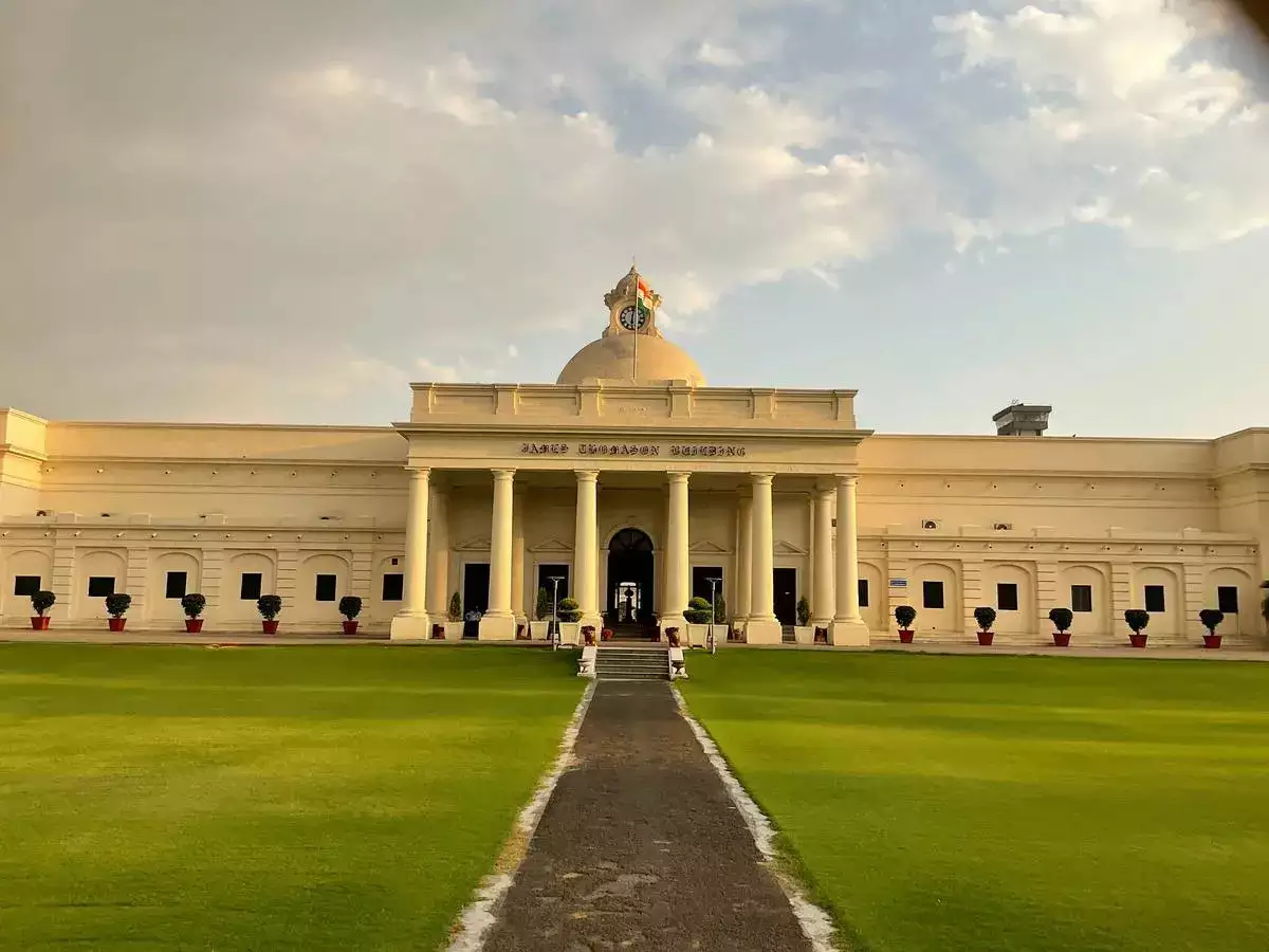 A medical college building surrounded by greenery