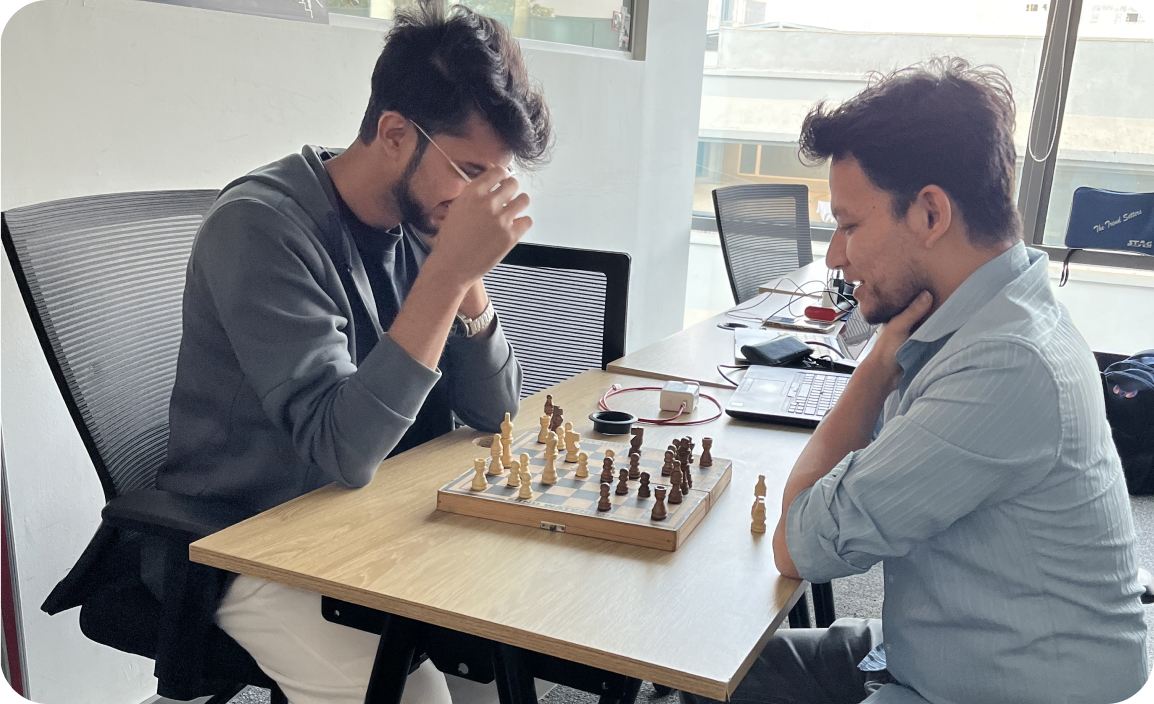 Team members playing chess at the office